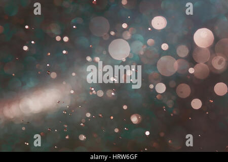 Vintage color bokeh abstract background caused by spray water. Stock Photo