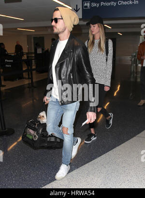 Kings of Leon brothers Caleb Followill and Jared Followill arrive at Los Angeles International (LAX) Airport  Featuring: Jared Followill, Martha Patterson Where: Los Angeles, California, United States When: 31 Jan 2017 Stock Photo