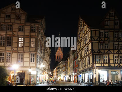 Hannover, Germany - September 9, 2016: Historic old town district with its half-timbered houses and a view of Marktkirche church at night. Stock Photo
