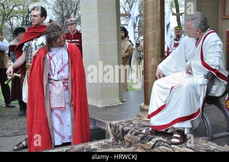 Actors reenact the trial of Jesus in praetorium before Pontius Pilate, during the street performances Mystery of the Passion. Stock Photo