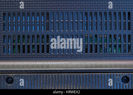 TV Rear view up close. Grating plastic cover on the back of the monitor. The detail of back-side of LCD television. Stock Photo