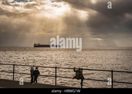 Container ship ACL Atlantic Conveyor leaving the port of Liverpool on the ruver Mersey passing Crosby beach. Stock Photo