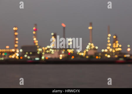 Abstract colorful bokeh background of Oil refinery industry plant at night Stock Photo