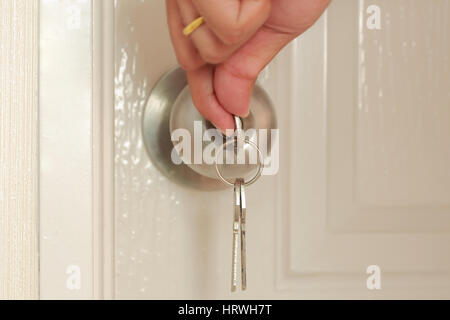 Opening door with Key insert and hold in stainless steel round ball door knob Stock Photo