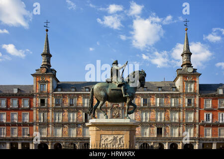 Plaza Mayor in city of Madrid in Spain, painted facade of Casa de la Panaderia and statue of King Philip III from 1616 Stock Photo