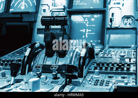 Airplane control stick in side pilot cockpit. Engine lever in the cockpit of an airliner. Center console and throttles in an airplane Stock Photo