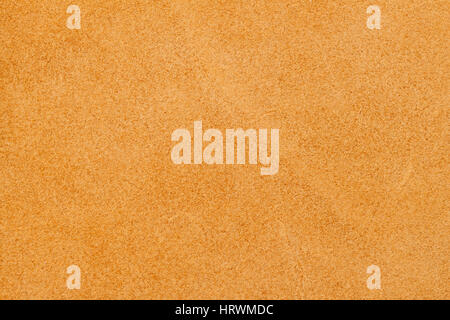 Texture of wrong side genuine leather close-up, cowhide, orange. For natural, artisan backgrounds, substrate composition use, vintage design Stock Photo