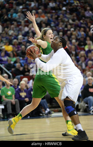 March 3, 2017: UW center Chantel Osahor (0) gets by Oregon defender Mallory McGwire (44) during a PAC12 women's tournament game between the Washington Huskies and the Oregon Ducks. The game was played at Key Arena in Seattle, WA. Jeff Halstead / CSM Stock Photo