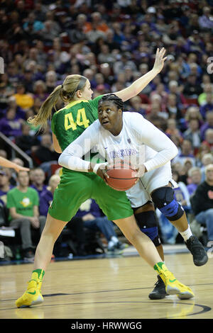March 3, 2017: UW center Chantel Osahor (0) spins around Oregon defender Mallory McGwire (44) during a PAC12 women's tournament game between the Washington Huskies and the Oregon Ducks. The game was played at Key Arena in Seattle, WA. Jeff Halstead / CSM Stock Photo