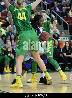 March 3, 2017: UW center Chantel Osahor (0) is double teamed by the Ducks Sabrina Ionescu (20) and Mallory McGwire (44) during a PAC12 women's tournament game between the Washington Huskies and the Oregon Ducks. Oregon won the game 70-69 in front of sold out crowd of 9,686 fans in Key Arena, Seattle, WA. Jeff Halstead / CSM Stock Photo