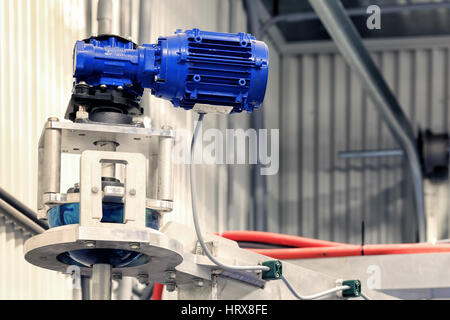 The motor and gearbox to drive the cleaning brushes in a modern automatic car wash. Stock Photo