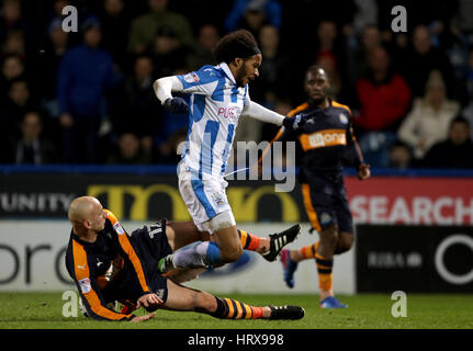 Newcastle United's Jonjo Shelvey tackles Huddersfield Town's Isaiah Brown during the Sky Bet Championship match at the John Smith's Stadium, Huddersfield. Stock Photo
