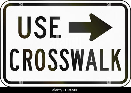 United States MUTCD regulatory road sign - Use crosswalk. Stock Photo