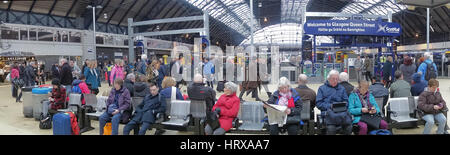 Queen Street station Glasgow tourists waiting for trains night panorama wide Stock Photo