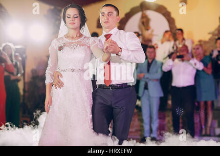 first wedding dance of a young couple in the restaurant Stock Photo