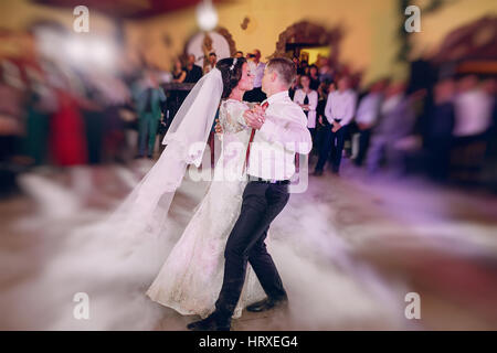 first wedding dance of a young couple in the restaurant Stock Photo