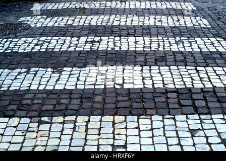 Pedestrian crossing lines in porphyry blocks Stock Photo