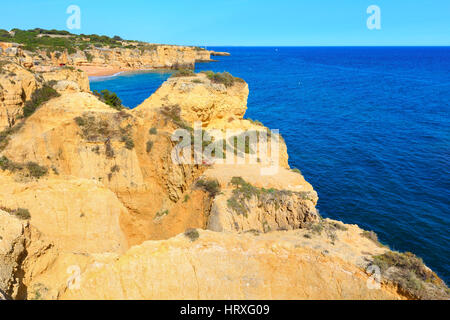 Summer Atlantic rocky coast view with sandy beach Praia da Coelha (Albufeira, Portugal). Stock Photo