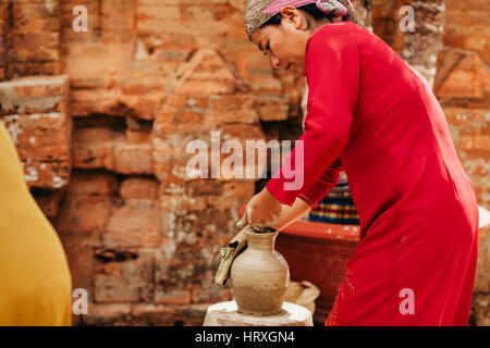Nha Trang, VIETNAM - CIRCA February 2015 - unidentified woman creates clay pot  traditional handicraft in Vietnam Stock Photo