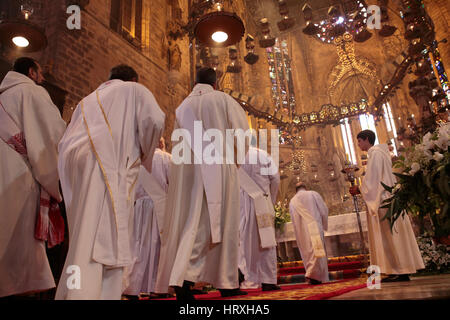 Believers and Monks in Palma de Mallorcas cathedral during a Sunday mass. Stock Photo