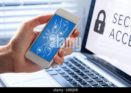 Mobile phone cyber security concept with a person showing smartphone screen, cybersecurity diagram and icons with microchip shape and fingerprint biom Stock Photo
