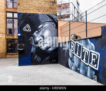 Berlin, Prenzlauer Berg. Mural artwork of black man outside Bite talent management agency in building courtyard Stock Photo