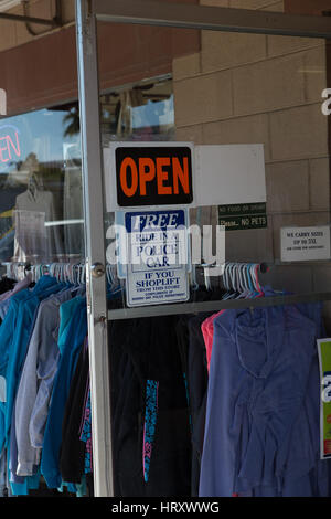Shoplifting sign on store in Morro bay California USA.Free ride in police car if you shoplift from this store compliments Morro bay police department. Stock Photo
