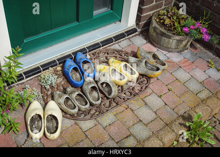Collection of klomps in front of the door. Stock Photo