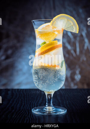 Fresh cocktail glowing in the dark Stock Photo