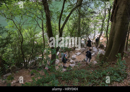 People coming down the trail to the river Ardèche, France. Stock Photo