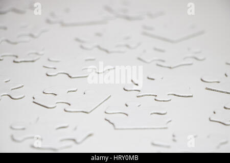 Blank Puzzle Pieces on White Surface Stock Photo