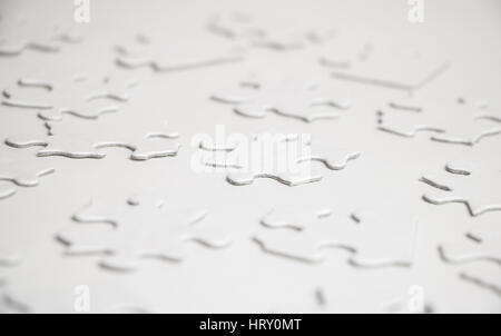 Blank Puzzle Pieces on White Surface Stock Photo