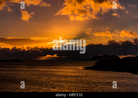 Sunset with crepuscular light across Loch Beag, Isle of Skye, looking out to Ullinish Point, Bracdale Point, Ardtreck Point and Isle Oronsay