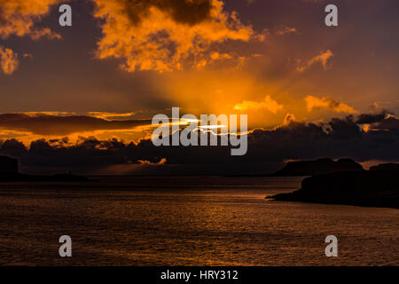 Sunset with crepuscular light across Loch Beag, Isle of Skye, looking out to Ullinish Point, Bracdale Point, Ardtreck Point and Isle Oronsay