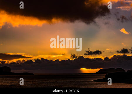 Sunset with crepuscular light across Loch Beag, Isle of Skye, looking out to Ullinish Point, Bracdale Point, Ardtreck Point and Isle Oronsay