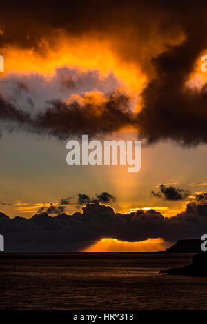 Sunset with crepuscular light across Loch Beag, Isle of Skye, looking out to Ullinish Point, Bracdale Point, Ardtreck Point and Isle Oronsay