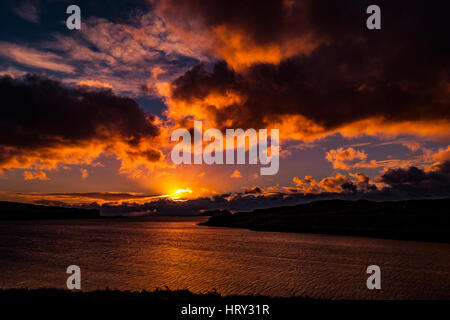 Sunset with crepuscular light across Loch Beag, Isle of Skye, looking out to Ullinish Point, Bracdale Point, Ardtreck Point and Isle Oronsay