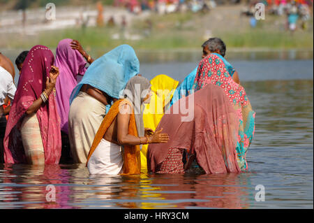 Bhil people gather in the waters during Baneshwar Mela Stock Photo - Alamy