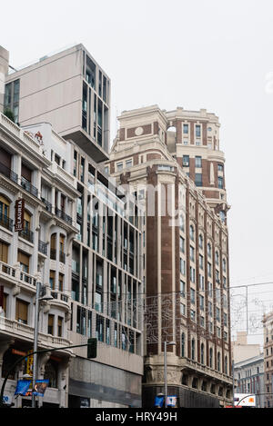 Madrid, Spain - November 20, 2016: Rainy day in Gran Via in Madrid. It is an ornate and upscale shopping street located in central Madrid. It is known Stock Photo