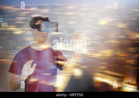 double exposure of man in virtual reality headset glasses Stock Photo