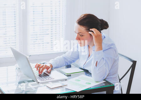 business woman working on computer in modern office Stock Photo