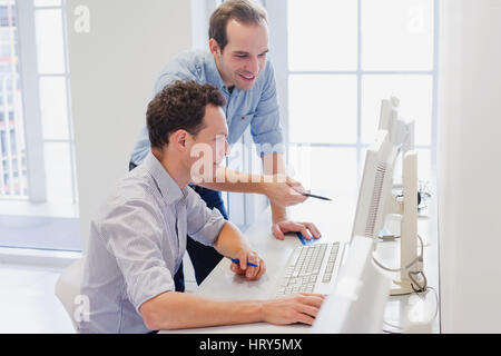 business team working together on computer, businessman discussing project in the office Stock Photo