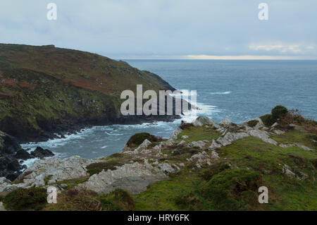 Clifftop at Botallack in the early evening light looking across the Atlantic to the Isles of Scilly Stock Photo
