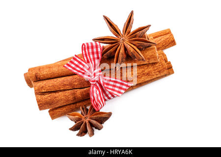 cinnamon sticks and anise stars on white Stock Photo