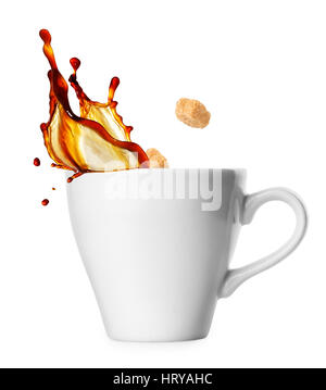 small classical white cup of coffee espresso with splash and falling sugar cubes isolated on white background. Coffee splash from a cup. Cane sugar cu Stock Photo