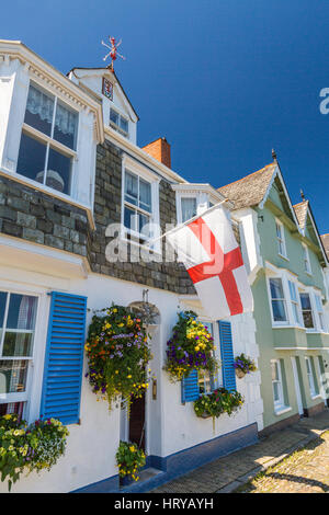 The English flag of St George being flown from a house in Bayards Cove in Dartmouth, Devon, England, UK Stock Photo