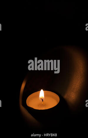 candle in aromatic oil burner Stock Photo