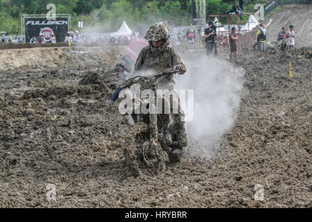 Pangkalpinang, Indonesia. 05th Mar, 2017. Racer covered in mud at motocross MXGP Indonesia Grand Prix on March 5, 2017 in Pangkalpinang City. Torrential rain ahead of the Grand Prix of Indonesia have forced Youthstream to cancel the MXGP and MX2 sessions at the second round of the FIM World Motocross Championship. Credit: Resha Juhari/Pacific Press/Alamy Live News Stock Photo