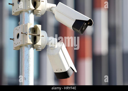 two white surveillance security cctv cameras Stock Photo