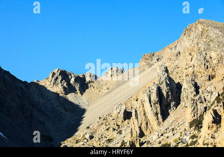 The white mountains with moon, near Samaria Gorge, Crete, Greece Stock Photo